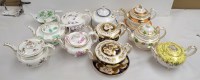 Lot 157 - Eleven squat circular teapots, 19th Century.