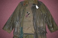 Lot 451 - A large lightweight waxed cotton green...