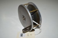 Lot 554 - An alloy and brass faced 4 1/2in. diameter fly...