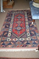 Lot 1721 - A Turkish rug, decorated with geometric floral...