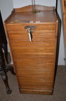Lot 1831 - An early 20th Century oak tambour front...