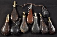 Lot 358 - Nine stiff leather or leather covered shot and...