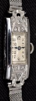 Lot 817 - An Art Deco lady's platinum cased and diamond...