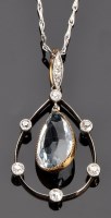 Lot 931 - An aquamarine and diamond drop pendant, the...