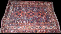 Lot 1041 - A Shiraz rug, with triple medallion to field...