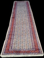 Lot 1058 - A Doroksh runner, decorated flowerhead design,...