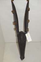Lot 182 - A West African elongated dog puppet mask,...