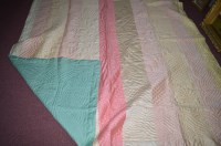 Lot 252 - An early 20th Century Durham quilt of multi...