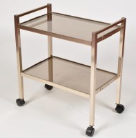 Lot 958 - An aluminium and smoked glass trolley, stamped...
