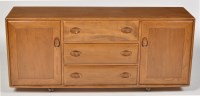 Lot 965 - Ercol: a Golden Dawn elm Windsor sideboard,...