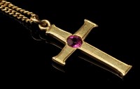 Lot 398 - A ruby and yellow metal crucifix pattern...