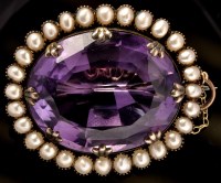 Lot 421 - An Victorian amethyst and half pearl brooch,...