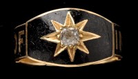 Lot 423 - A Victorian black enamel, diamond and 18ct....