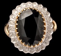 Lot 428 - A sapphire and diamond dress ring, the oval...