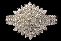 Lot 429 - A diamond dress ring set with multiple tiers...