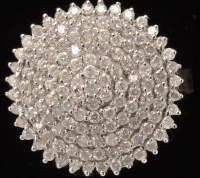 Lot 430 - A diamond dress ring, set with multiple tiers...