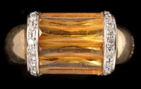 Lot 451 - A citrine and diamond dress ring, the scissor...