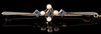 Lot 486 - A sapphire and pearl bar brooch, the...