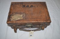 Lot 253 - An early 20th Century leather on wood...