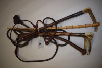 Lot 290 - Three antler handled riding crops with silver...