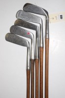 Lot 408 - Five hickory shafted putters, makers to...