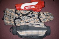 Lot 451 - Golfing bags, comprising: two by Burberry; and...