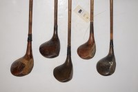 Lot 465 - Five hickory shafted drivers, some with lead...