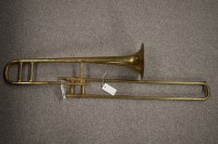Lot 1509 - A brass trombone by Corton, cased.