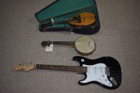 Lot 1541 - An Ariastg-Series electric guitar with black...