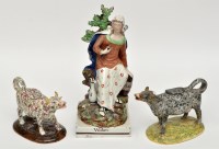 Lot 109 - Two sponged earthenware cow creamers and...