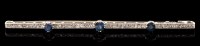 Lot 545 - An Edwardian style sapphire and diamond bar...