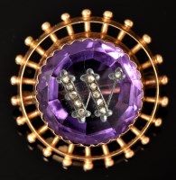 Lot 557 - An amethyst, diamond and yellow metal brooch,...