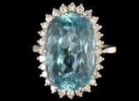 Lot 583 - An aquamarine and diamond cluster ring, the...