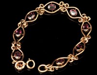 Lot 618 - A garnet and yellow metal bracelet, c.1900,...