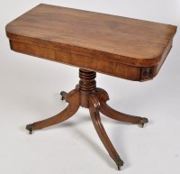 Lot 823 - A Regency mahogany turnover swivel top card...