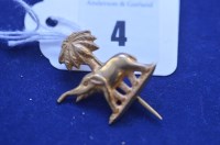 Lot 4 - A yellow metal brooch depicting an elephant in...