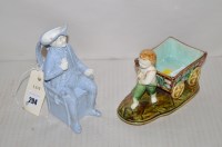 Lot 294 - A 19th Century blue and white seated toby jug,...