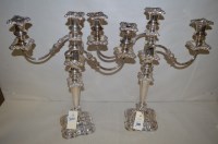 Lot 300 - A pair of silver-plated three-branch...