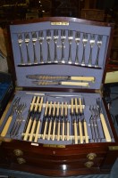 Lot 398 - A mahogany canteen of silver-plated cutlery,...