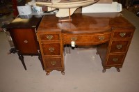 Lot 655 - An early 20th Century figured walnut kneehole...