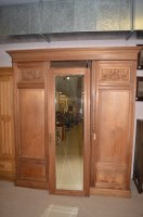 Lot 656 - A late 19th Century stripped walnut three door...