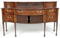 Lot 863 - A Georgian style serpentine front mahogany...