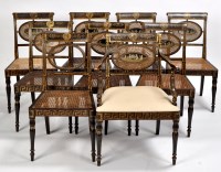 Lot 884 - A set of nine Regency ebonised beech and...