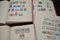 Lot 170 - Two volumes of The New Age Stamp Album,...