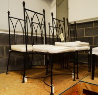 Lot 94 - Five modern black painted wrought iron dining...