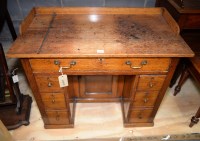 Lot 164 - A 19th Century small oak kneehole writing...