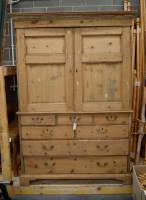 Lot 215 - A 19th Century stripped pine linen press...