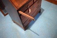 Lot 330 - A George I walnut bureau cabinet, the top with...