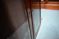 Lot 330 - A George I walnut bureau cabinet, the top with...