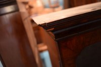 Lot 330 - A George I walnut bureau cabinet, the top with...